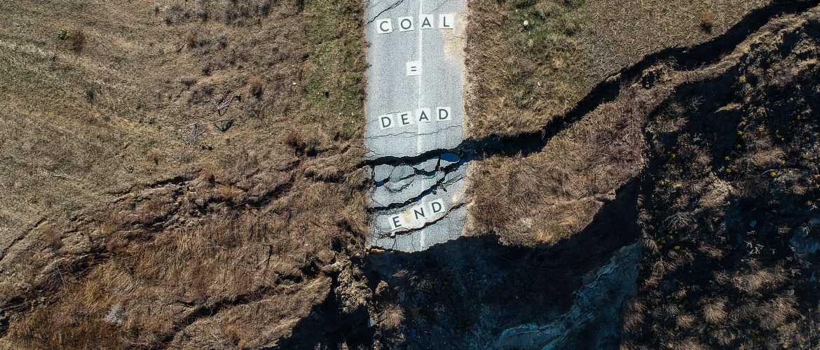 Mining view from the top with "Coal is a dead-end" message
