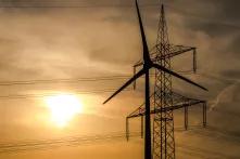 Wind turbine and high-voltage lines in the background