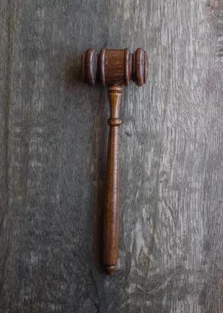 brown mallet on gray wooden surface brown mallet on gray wooden surface